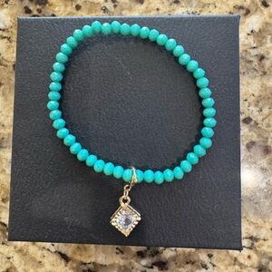 Elegant Turquoise Beaded Bracelet with Gold Charm
